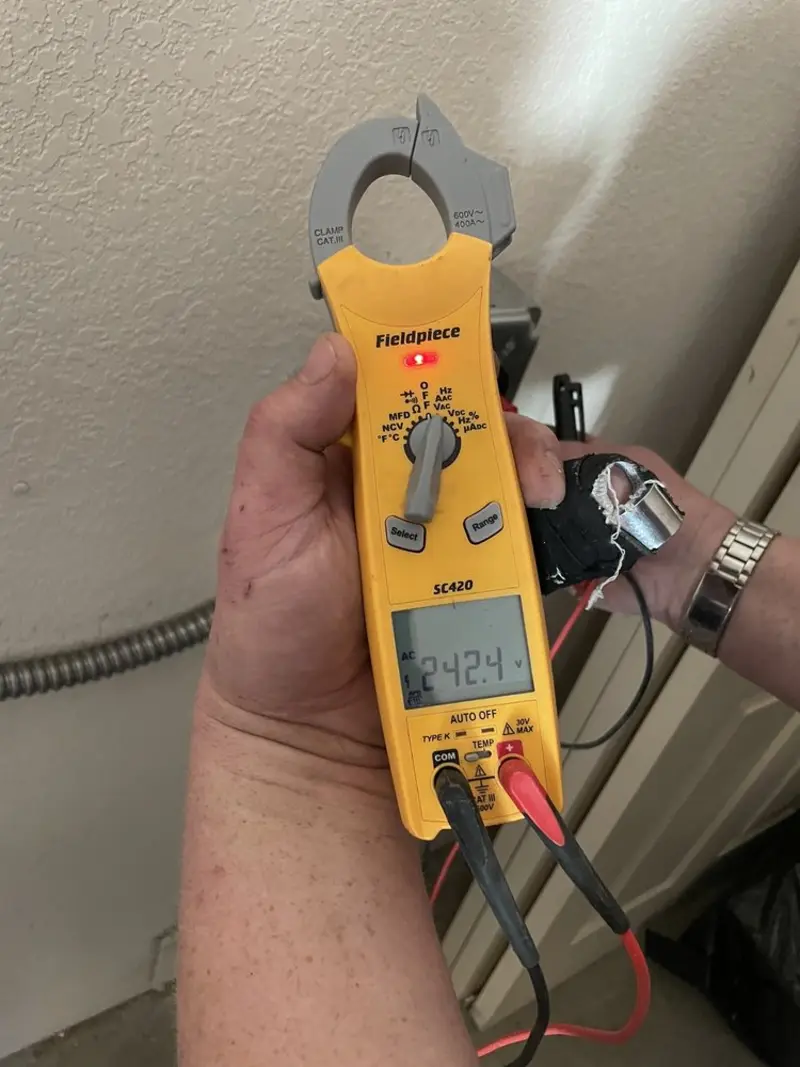 Voltage testing with clamp meter during Ceiling Fan Installation in Atlas